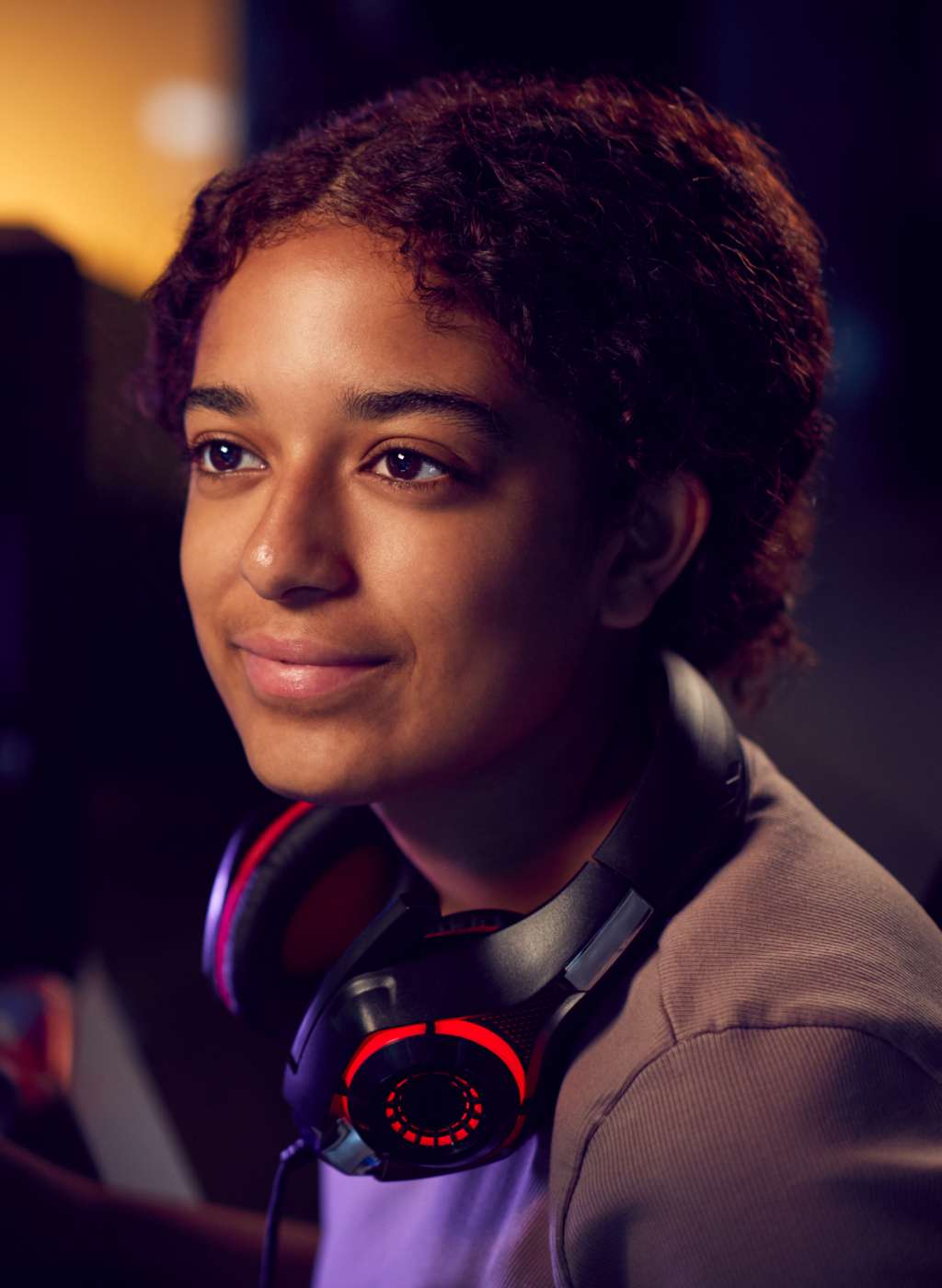 teenage-girl-with-headset-gaming-at-home-using-dua-CPT4T4P-6.jpg